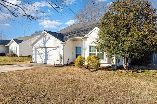 view of front of home featuring a garage and a front yard