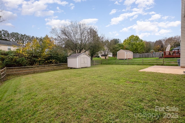 view of yard with a patio area and a storage unit