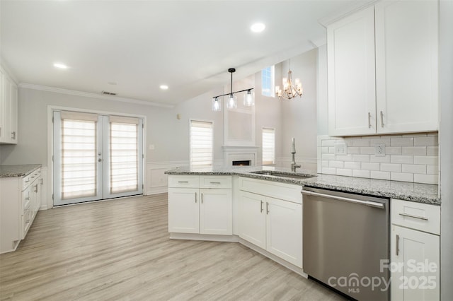 kitchen featuring sink, dishwasher, light stone countertops, light hardwood / wood-style floors, and white cabinets