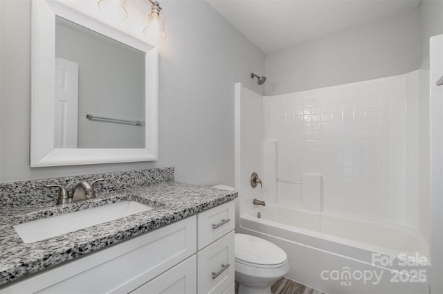 full bathroom featuring shower / tub combination, vanity, and toilet