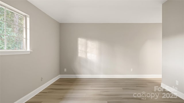 spare room with light hardwood / wood-style flooring