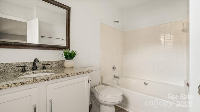 full bathroom with tiled shower / bath combo, vanity, and toilet