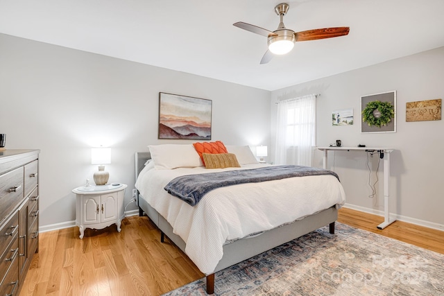 bedroom featuring ceiling fan and light wood-type flooring