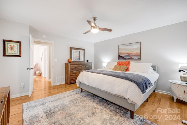 bedroom featuring hardwood / wood-style flooring and ceiling fan