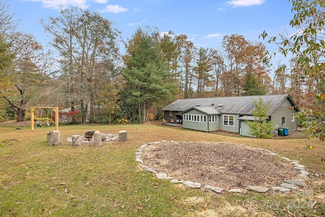 view of yard with an outdoor fire pit