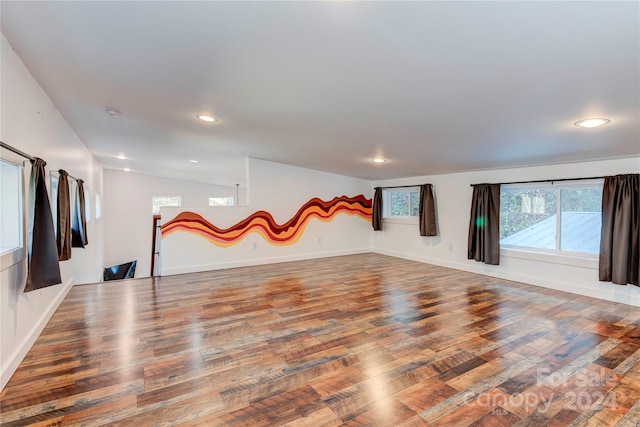 spare room featuring wood-type flooring