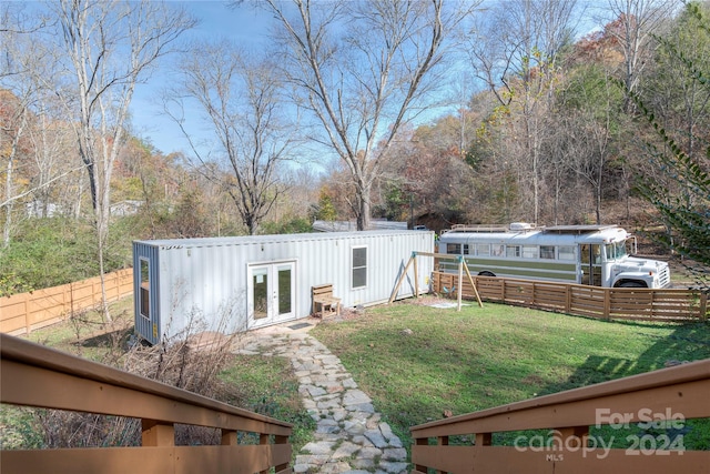 view of yard featuring french doors