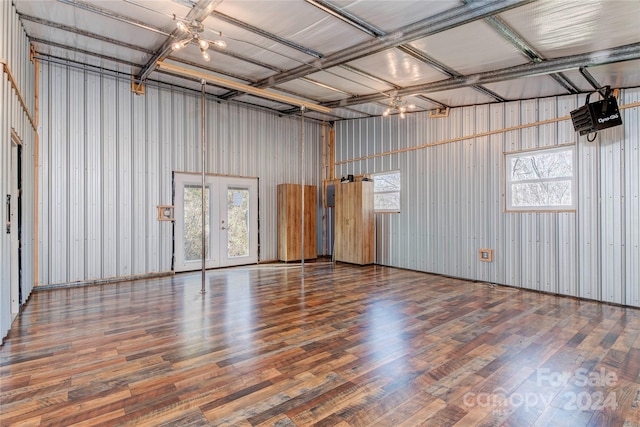 garage featuring wood walls