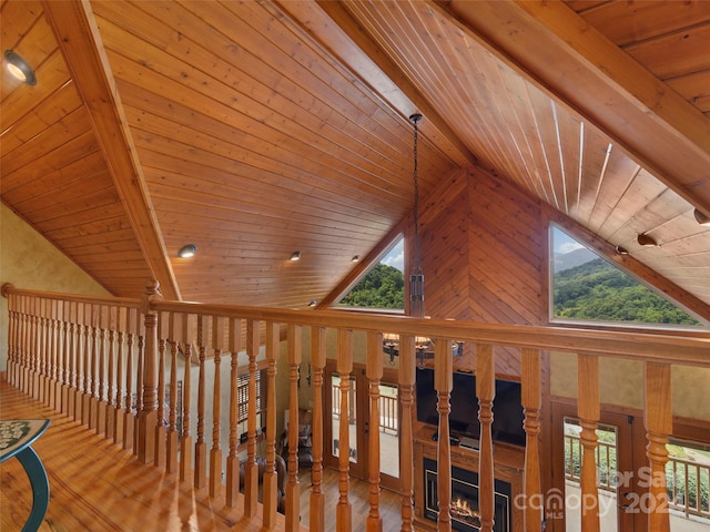 corridor featuring high vaulted ceiling, beamed ceiling, wood ceiling, and hardwood / wood-style flooring