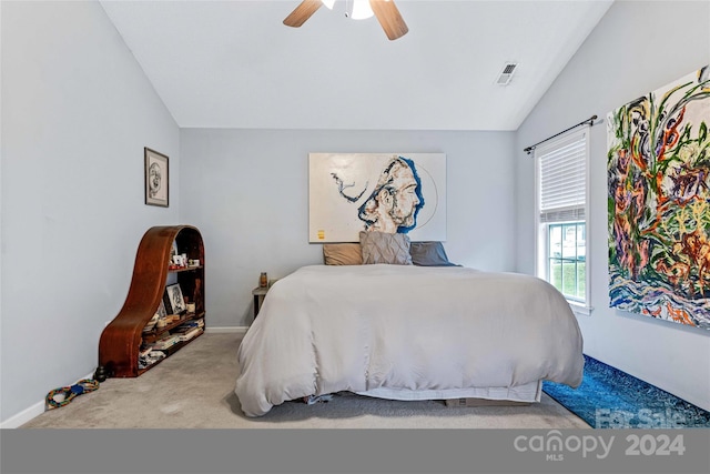 carpeted bedroom featuring ceiling fan and lofted ceiling