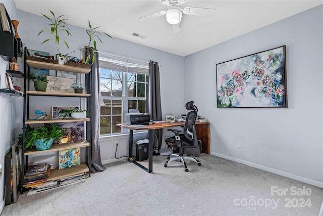 carpeted office with ceiling fan