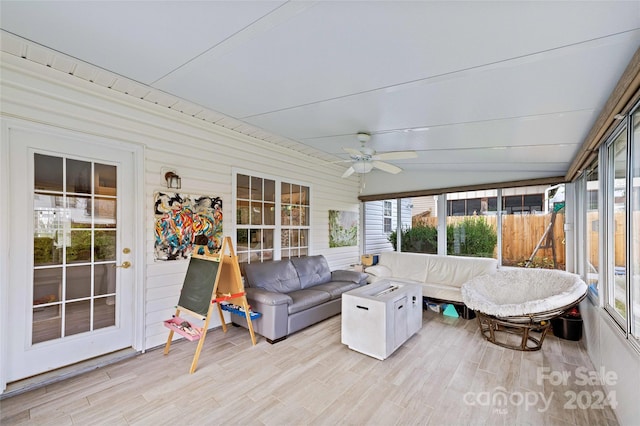 sunroom featuring vaulted ceiling, a wealth of natural light, and ceiling fan