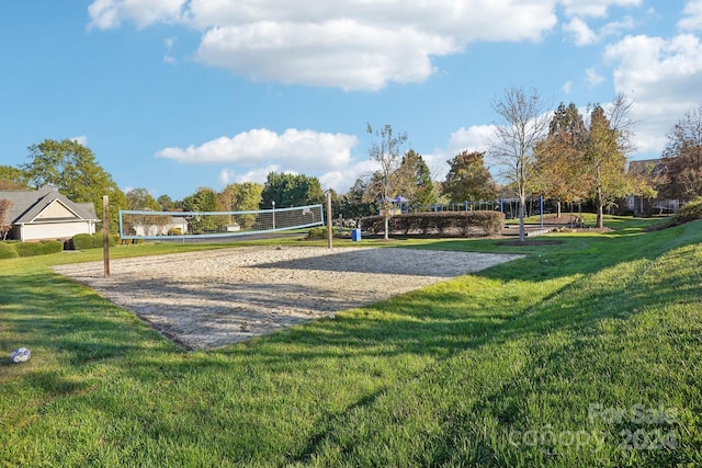 view of home's community with a lawn and volleyball court