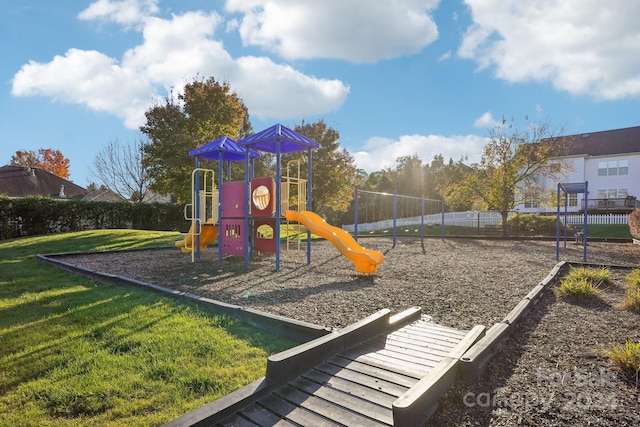 view of jungle gym featuring a yard