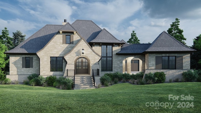 french provincial home featuring a front yard