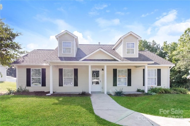 714 Knots Lndg, Clover, SC 29710 - cape cod house with a front yard, covered porch, and roof with shingles