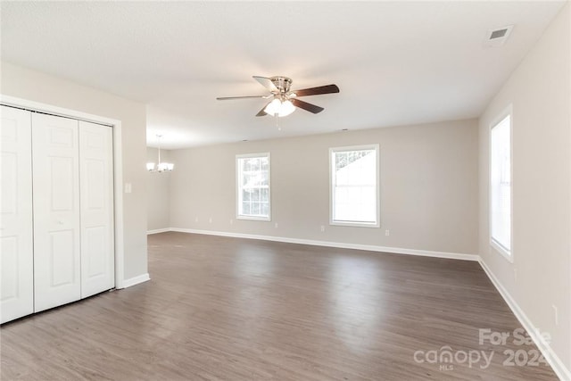 714 Knots Lndg, Clover, SC 29710 - unfurnished bedroom with a chandelier, dark wood-style floors, baseboards, and a closet