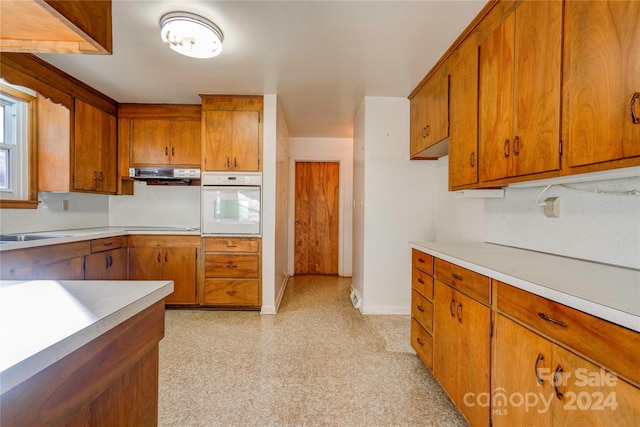 kitchen with cooktop and oven