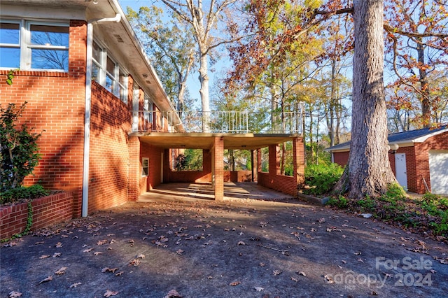 view of home's exterior featuring a carport