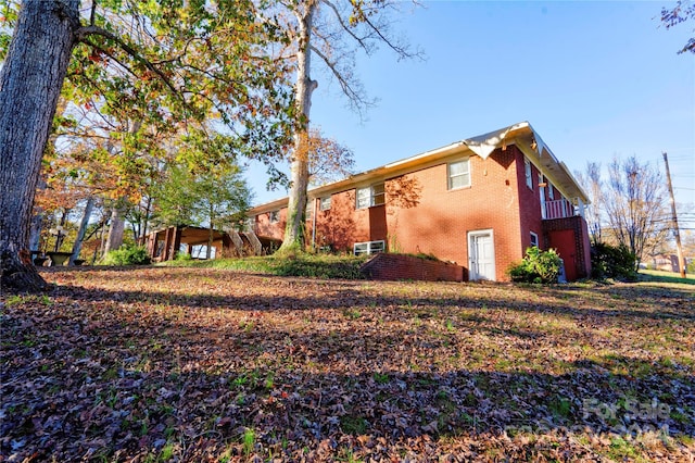 view of side of home featuring a garage