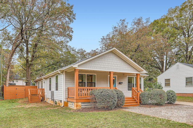 bungalow featuring a front lawn and a porch