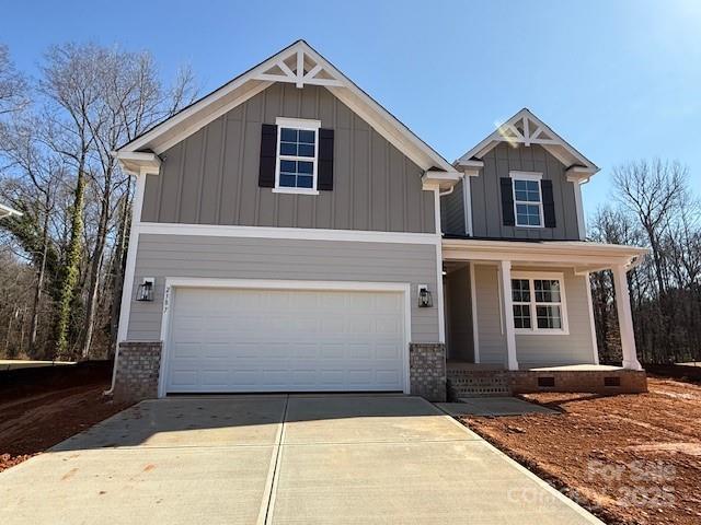 craftsman-style home with a garage and covered porch