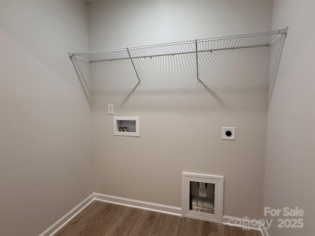 washroom with hookup for an electric dryer, laundry area, washer hookup, baseboards, and dark wood-style floors