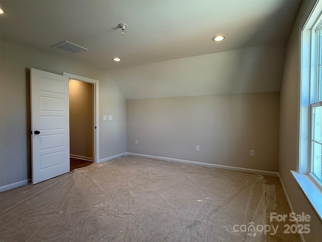 bonus room with lofted ceiling, visible vents, and baseboards