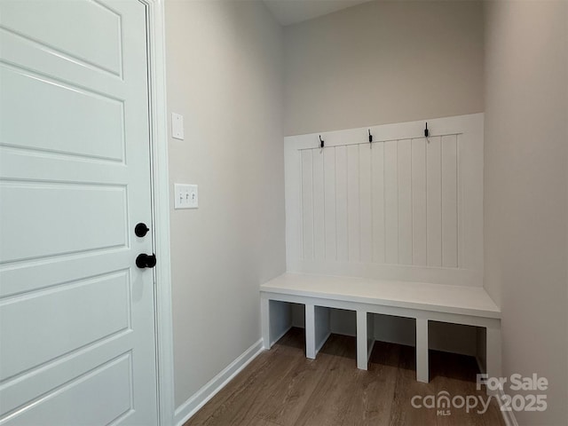 mudroom with baseboards and wood finished floors