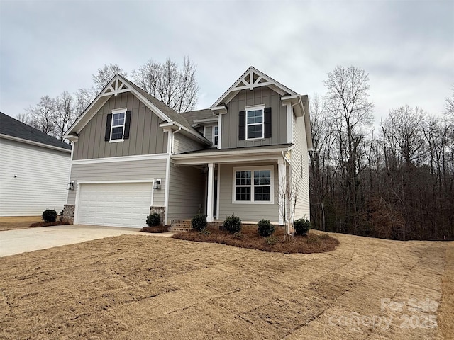 craftsman house featuring board and batten siding, driveway, and a garage