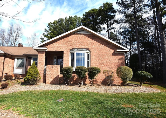 view of side of property featuring a yard