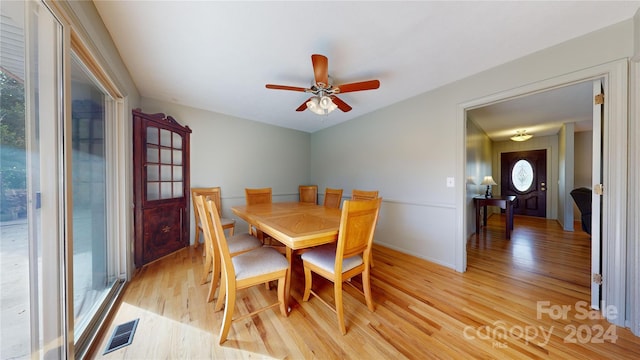 dining room featuring light hardwood / wood-style flooring and a healthy amount of sunlight