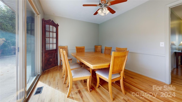 dining area with ceiling fan and light hardwood / wood-style flooring