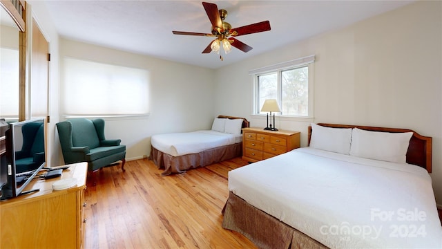 bedroom featuring hardwood / wood-style floors and ceiling fan