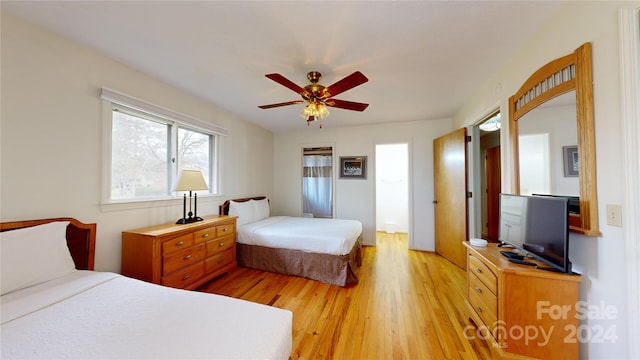 bedroom featuring ceiling fan and light hardwood / wood-style flooring