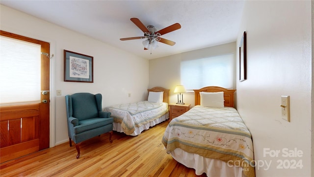 bedroom with ceiling fan and light hardwood / wood-style floors