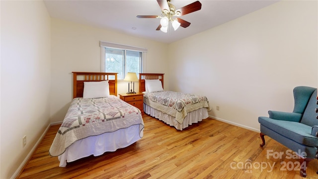 bedroom with ceiling fan and light hardwood / wood-style flooring