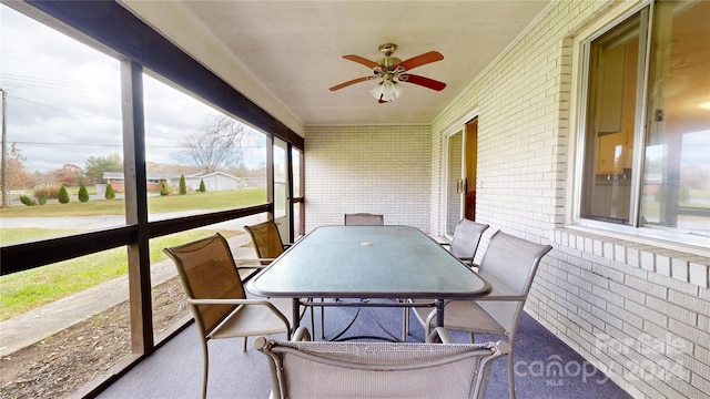 sunroom / solarium with ceiling fan