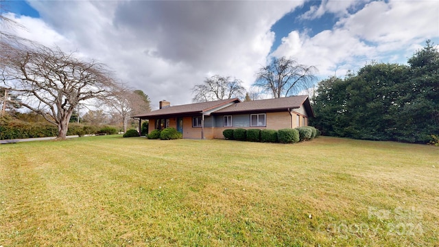 exterior space with a lawn