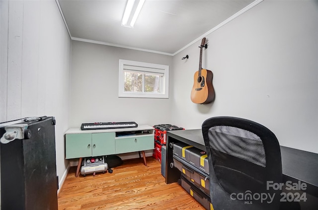 office space with crown molding and light hardwood / wood-style flooring