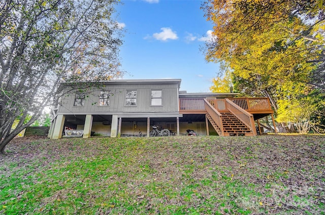 back of property featuring a wooden deck