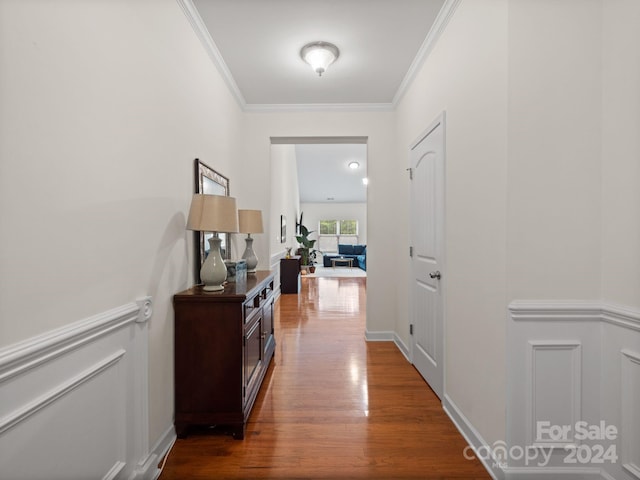 hallway featuring crown molding and dark wood-type flooring