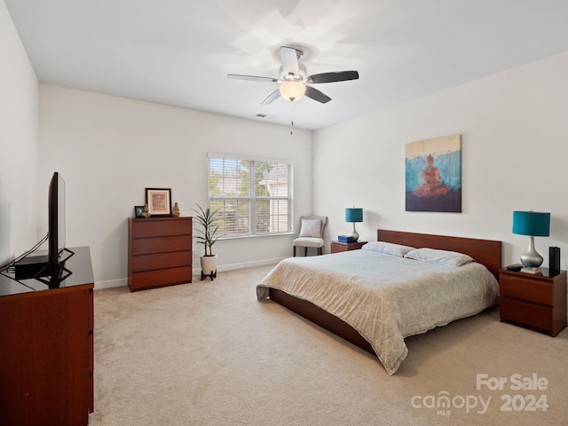 carpeted bedroom with ceiling fan