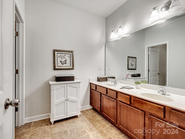 bathroom featuring tile patterned flooring and vanity