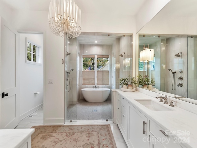 bathroom with shower with separate bathtub, plenty of natural light, vanity, and a chandelier