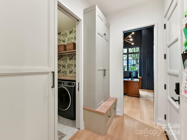 washroom featuring light wood-type flooring and washer / dryer