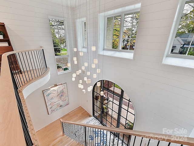 stairs featuring hardwood / wood-style floors