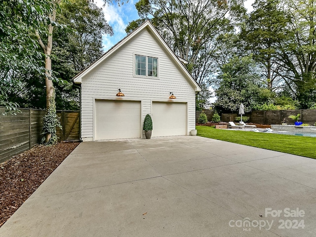 view of side of home featuring a garage