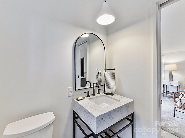 bathroom featuring sink and toilet