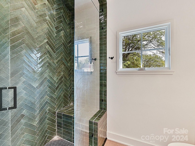 bathroom with a shower with shower door